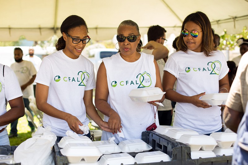 CFAL employees along with the Bahamas Feeding Network gathered to distribute food in Retirement Park.